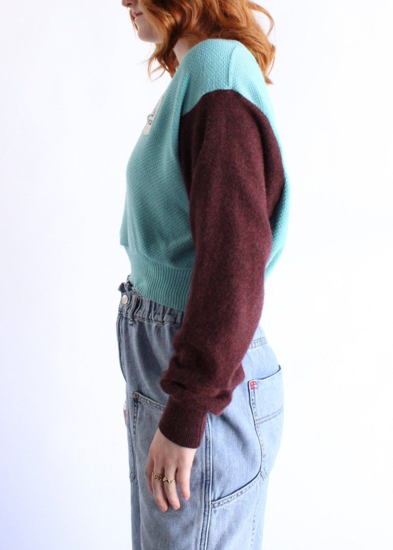 RCYCLD Switch Sleeve Crop V Sweater